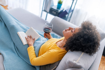 Relaxed young woman reading a book
