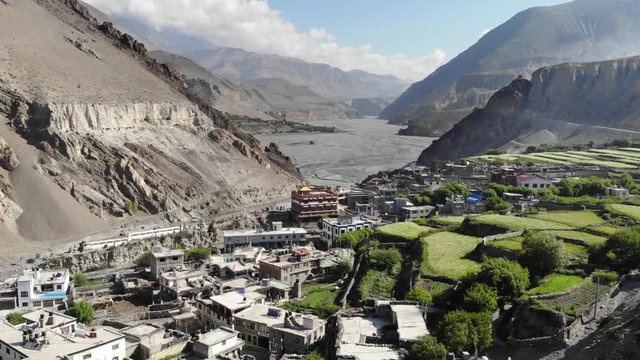 Aerial view of Kagbeni and the mountain valley in the Himalayas. Old houses and agricultural fields. Upper Mustang. Nepal.