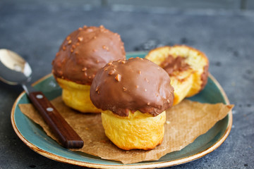 Brioche bun with chocolate filling and chocolate coating.
