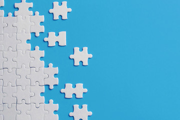 White details of puzzle on blue background