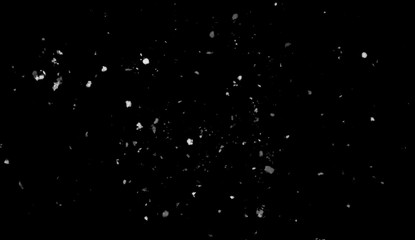 Freeze motion of white snow coming down, isolated on black background. Design texture element.