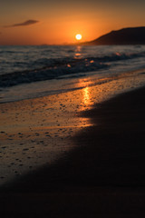 Fototapeta na wymiar Orange sunrise over sea