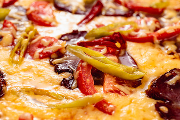 Appetizing pizza on a wooden background