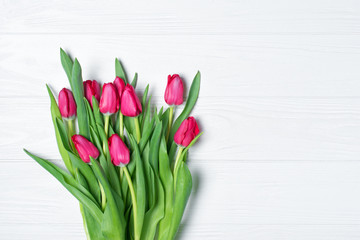 Beautiful bouquet of fresh pink tulips on white