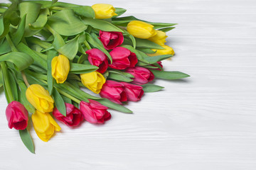 Beautiful bouquet of fresh yellow and pink tulips