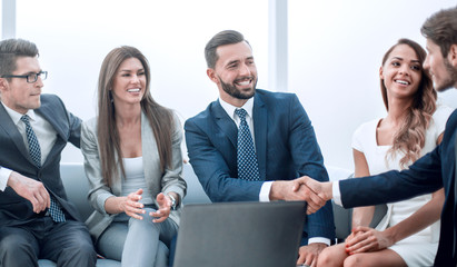 business partners shaking hands during negotiations