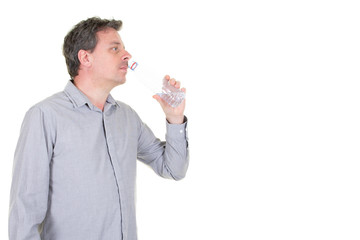 Man profile drinking water form a bottle in white background and copy space