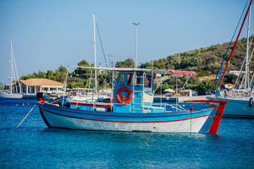 Fishing boat in a calm water. Wooden old wooden fishing boat.