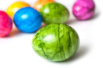 closeup of decorative painted easter eggs on white background