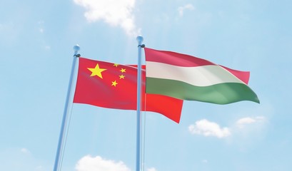 Hungary and China, two flags waving against blue sky. 3d image