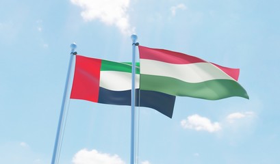 Hungary and UAE, two flags waving against blue sky. 3d image