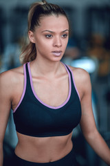 Fototapeta na wymiar close up.portrait of a confident young woman in the gym.