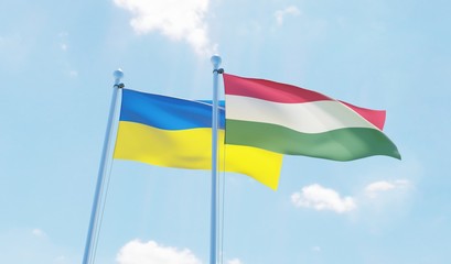 Hungary and Ukraine, two flags waving against blue sky. 3d image