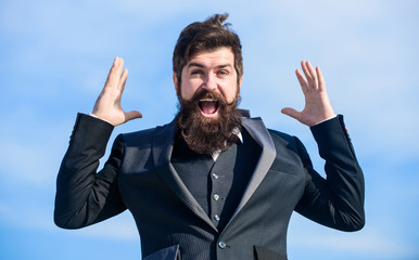 Man bearded optimistic businessman wear formal suit sky background. Success and luck. Optimistic...