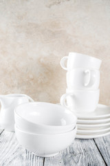 Stack clean empty kitchen utensils