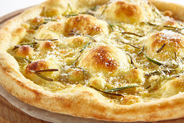 Thin Crispy Focaccia with Mozzarella, Rosemary, Grated Parmesan Cheese, Butter, Greens, Basil Oil