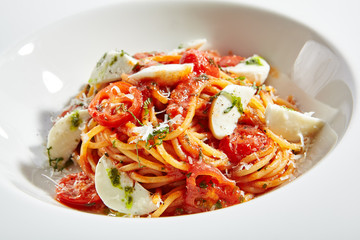 Spaghetti with Milk Mozzarella and Tomato Sauce Close Up