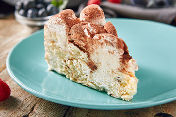 Triangular Slice of Tiramisu with Coffee, Mascarpone Cheese and Cocoa