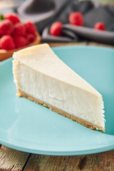 Classic Plain New York Cheesecake on Blue Plate