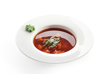 Red Soup with Seafood in White Plate Isolated