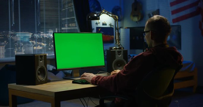 Man using his computer at home