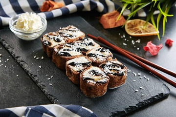 Sweet Chocolate Maki Sushi Pancake Rolls with Fruits Close Up
