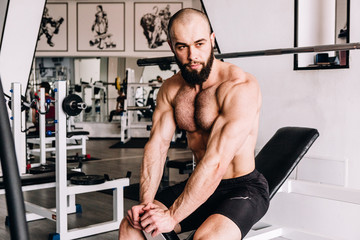 Fototapeta premium Muscular guy in the gym 