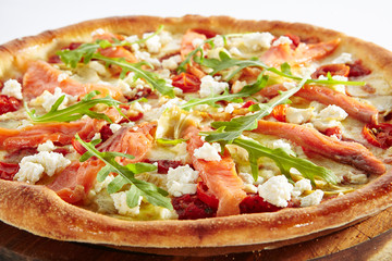 Pizza with Salmon, Pickled Artichokes and Arugula Isolated