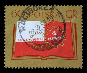 Stamp printed in Poland shows Open book and cogwheels, Polish-Soviet friendship, circa 1956.