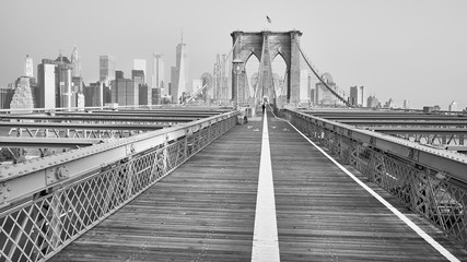 Black and white picture of Brooklyn Bridge and Manhattan skyline, NYC.
