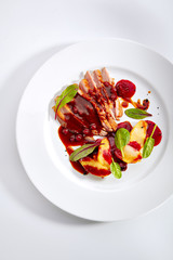 Duck Breast with Baked Apple and Peach Cream on Elegant Restaurant Plate