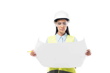 Concentrated engineer in safety vest looking at blueprint isolated on white