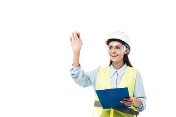 Engineer in hardhat holding clipboard and waving hand isolated on white