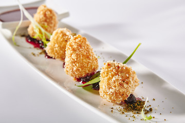 Hot Appetizers of Deep Fried Camembert with Sweet Jam