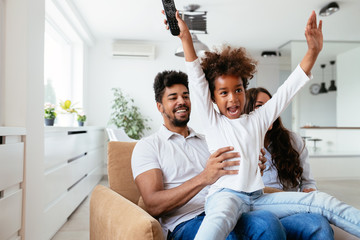 Happy young family relax and have fun at home