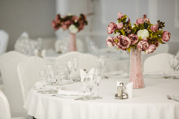 Idea of arranging the holiday table, crystal glasses on white background.