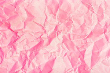 Texture of crumpled paper. Trendy pink background.