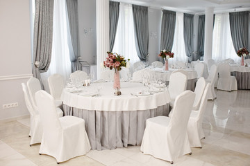 Idea of arranging the holiday table, crystal glasses on white background.