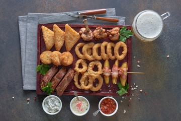 A range of snacks and mug of beer