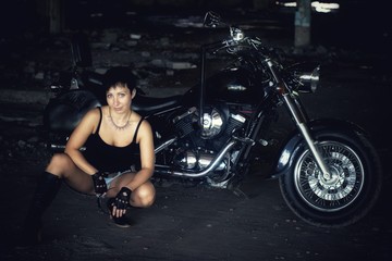 Obraz na płótnie Canvas Strong independent , self-sufficient girl with male fascination on chopper motorcycle, international womens day concept