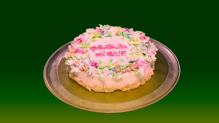 Birthday cake on a green background