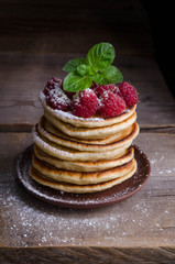  Pancakes with raspberries  on wooden table