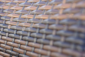 Natural brown texture of wicker rods, Wicker rattan texture, closeup.