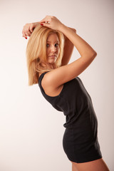 Fototapeta premium Beautiful blond girl posing in the studio