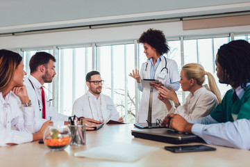 Fototapeta premium Medical team sitting and discussing at the table in the office.