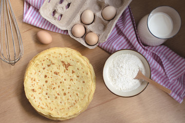 crepes preparation concept with ingredients on tabletop