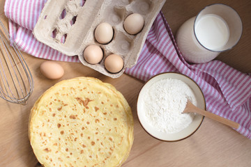 crepes preparation concept with ingredients on tabletop