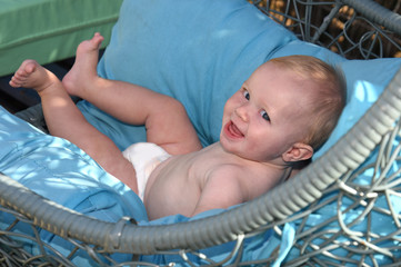 boy resting on a blue mattress