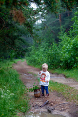 Portrait of happy joyful child on the forest background photo
