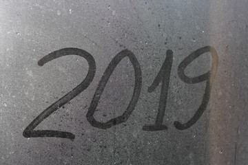 2019 the inscription on the glass after the rain